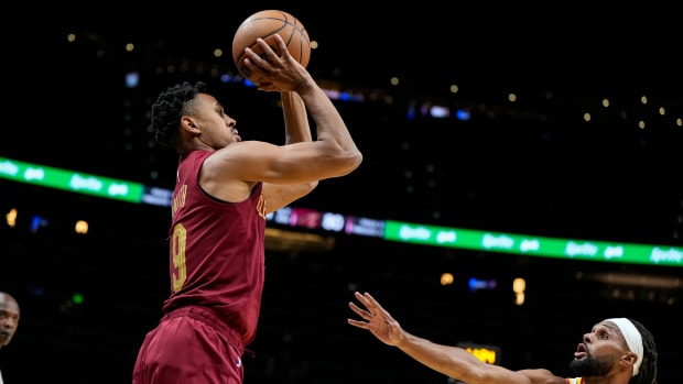 Oct 10, 2023; Atlanta, Georgia, USA; Cleveland Cavaliers guard Zhaire Smith (19) shoots over Atlanta Hawks guard Patty Mills (8) during the second half at State Farm Arena. Mandatory Credit: Dale Zanine-USA TODAY Sports 